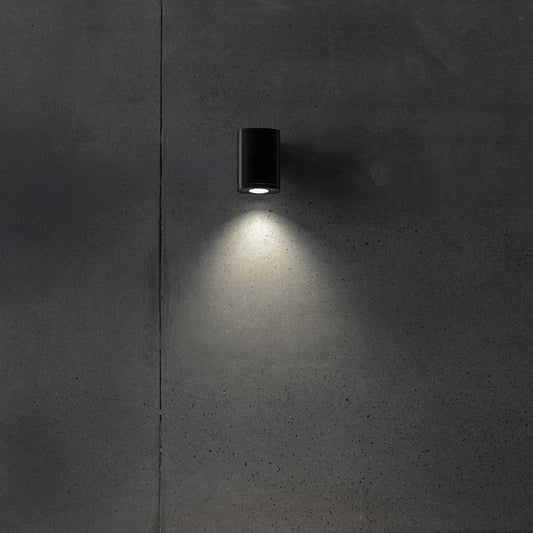 GU10 facade wall light illuminated on a wall